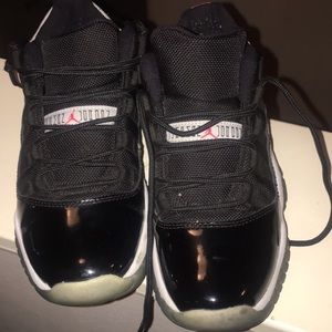 Kids black Jordan’s low 11